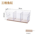 A small barrel-shaped fish tank with a built-in lighting system, a tabletop miniature landscape, and a mini aquarium s