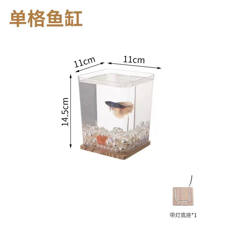 A small barrel-shaped fish tank with a built-in lighting system, a tabletop miniature landscape, and a mini aquarium s